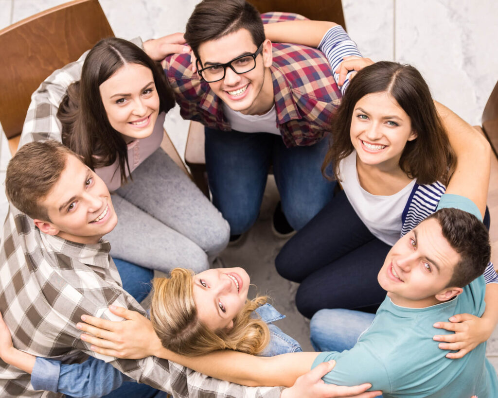 Young people hugging together